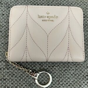 Kate Spade coin purse. New without tags. Very clean no damage at all
